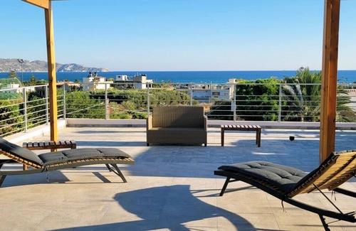 Agios Dimitrios Apartment | Crete aparthouse NortnModern Apartment with Shared Sea View Patio near beach