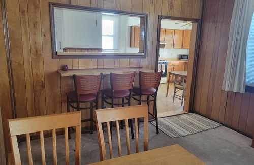 Morrell Park Hotel | Cute little cottage surrounded by shrubs, flowers, and peach trees.