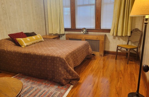 Morrell Park Hotel | Cute little cottage surrounded by shrubs, flowers, and peach trees.
