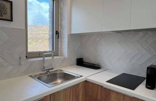 Koundouros Apartment | Discover Tzia Stone Studio where Modern Design meets Inspiring Sea Views