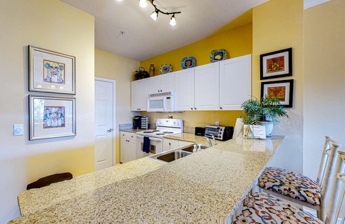Frangista Beach Condo | Dog-friendly condo with pool, hot tub, private balcony, AC, & washer/dryer