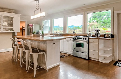 Landrum House | Dog-friendly farmhouse with hot tub, outdoor areas, & 3 fireplaces
