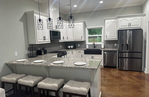 Titus House | Dogwood Cottage at Lake Jordan with boat dock/hot tub lakeside/RV parking spot