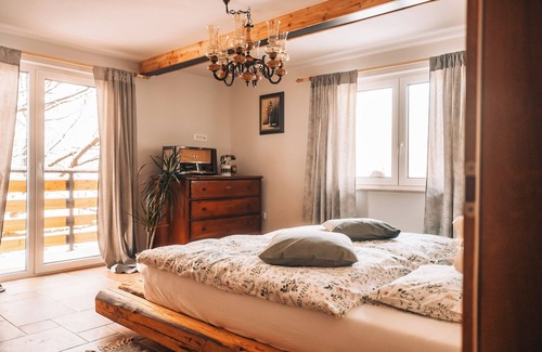Celje Bed & Breakfast | Double bedroom with balcony and idyllic view surrounded by nature