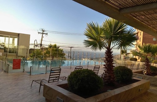 Renaca Apartment | Dream view in Viña, apartment in gorgeous area with WiFi, gym, pool and more.