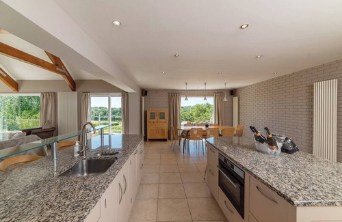 Coleraine Villa | Dundarragh Lodge, Stunning North Coast Villa With River Views & Hot Tub For 20+