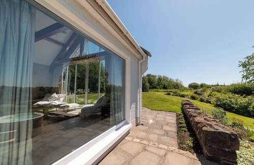 Coleraine Villa | Dundarragh Lodge, Stunning North Coast Villa With River Views & Hot Tub For 20+