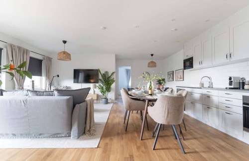 Bastad Condo | Earthy Ground Floor Home Patio Sunbeds Greenery