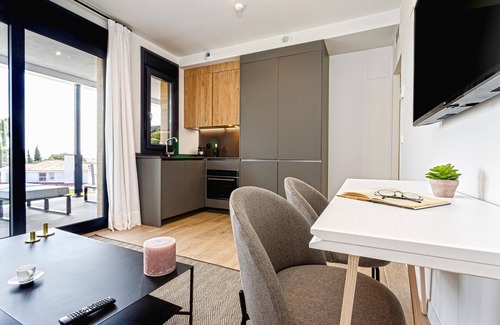 Distrito Norte Sierra Apartment | Elegant apartment with terrace & pool.Arruzafa V