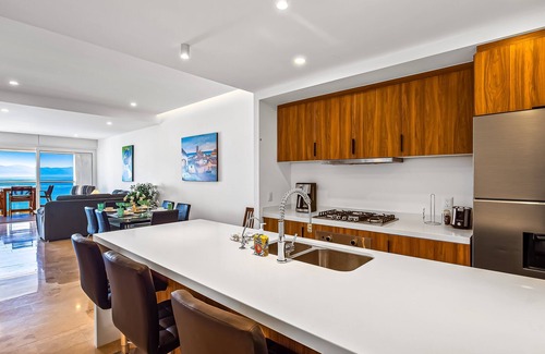 Las Glorias Condo | Elegant beachfront condo with stunning ocean views, heated pools & gym access
