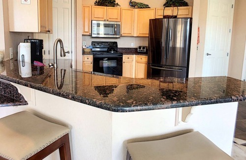 Loughman Condo | Elegant Condo w/Pool View Balcony Resort Pool & Gym. Near Disney/Shops