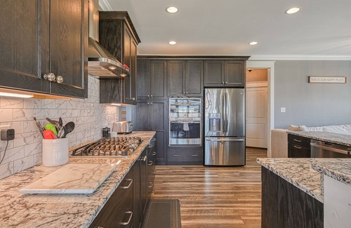 Livingston House | Elegant lakefront home with water access, hot tub, dock, rec room & fireplaces