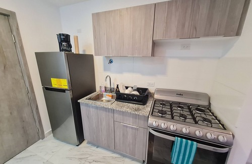 Tumba Vieja Apartment | En el Corazón del Area Bancaria, Lugares de Interes a Metros del Apartamento
