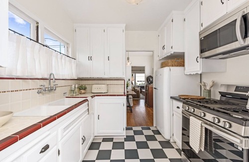 West Beach Apartment | Enjoy indoor-outdoor living, a full kitchen, and vintage coastal charm.