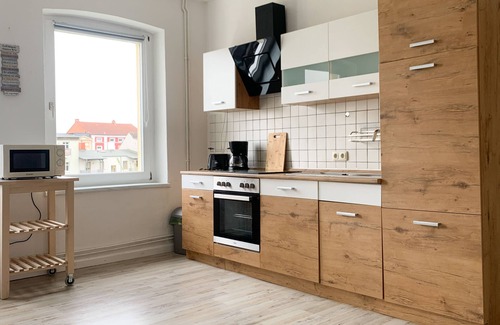 Schwerin Apartment | Entspannung Pur: Stadtnahe Ferienwohnung mit Grünem Rückzugsort im Garten