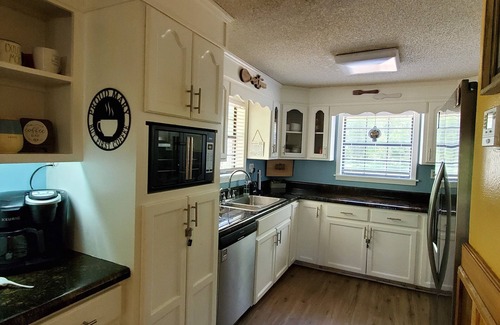 Lucedale Cabin | Escape City Life at this Exceptional Cabin Retreat with River Views.