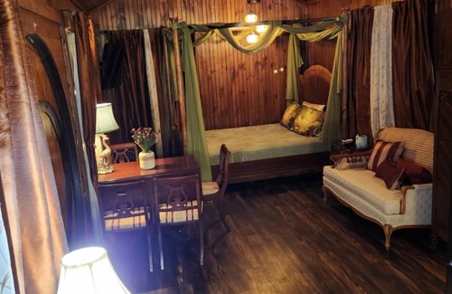 Hamptonville Cottage | Escape to a Hobbit cottage overlooking a pond with water wheel in wine country!