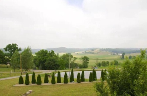 Dundee Cottage | Escape to our romantic stone cottage by a pond overlooking Amish country
