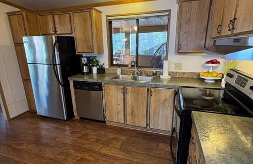 Munds Park Cabin | Escape to Pinewood Canyon Cabin — a cozy 2BR/2BA retreat nestled in the pines of Munds Park. With Inviting interiors, a relaxing deck, and direct forest access, it’s the perfect basecamp for year-round adventure and mountain serenity.