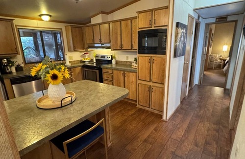 Munds Park Cabin | Escape to Pinewood Canyon Cabin — a cozy 2BR/2BA retreat nestled in the pines of Munds Park. With Inviting interiors, a relaxing deck, and direct forest access, it’s the perfect basecamp for year-round adventure and mountain serenity.
