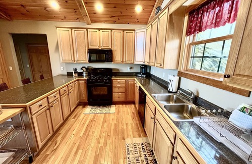 Wolf Laurel House | Escape to serene mountain bliss in this stunning mountain home.