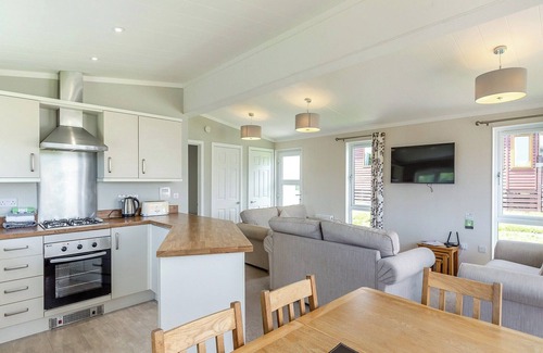Hewas Water Ski Chalet | Escape to the Jasmine Lodge, nestled amidst stunning rolling countryside.