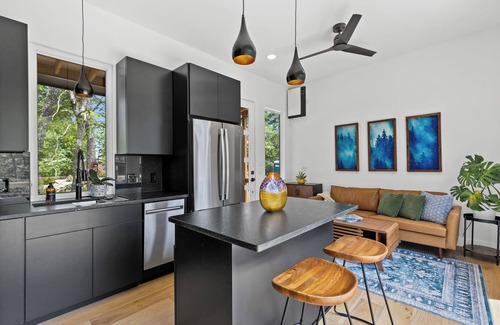 Young Harris Apartment | Escape to this modern 1BR/1BA tiny home in the North Georgia mountains. Enjoy a full kitchen, spa-style rain shower, private deck with forest views, and seasonal access to a shared pool. Perfect for rest, recharge, and reconnecting with nature.