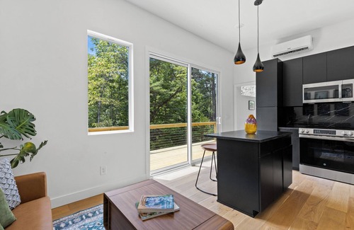 Young Harris Apartment | Escape to this modern 1BR/1BA tiny home in the North Georgia mountains. Enjoy a full kitchen, spa-style rain shower, private deck with forest views, and seasonal access to a shared pool. Perfect for rest, recharge, and reconnecting with nature.