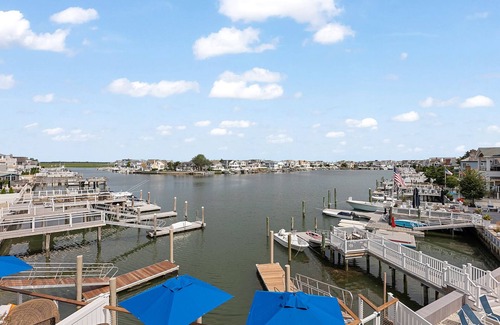 Stone Harbor House | EXCEPTIONAL LUXURY, CUSTOM, NEW CONSTRUCTION BAY FRONT HOME WITH POOL AND 3-STOP ELEVATOR.