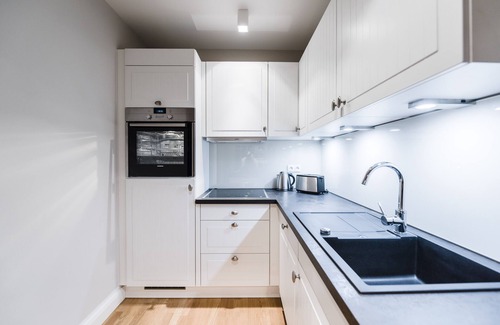 Loddin Condo | Exclusive apartment with daily. Cleaning, fireplace, water views, laundry incl.