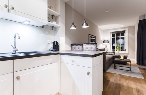 Loddin Condo | Exclusive apartment with daily. Cleaning, fireplace, water views, laundry incl.