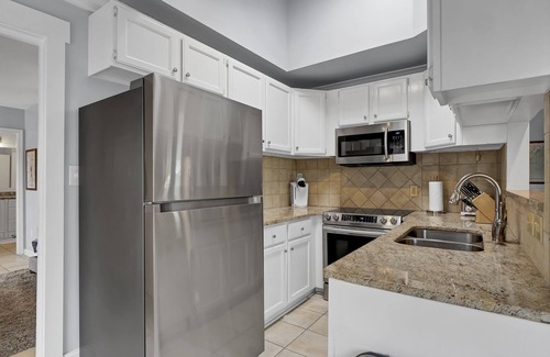 Airlie Condo | Experience Coastal Luxury at The Waterway 405: Marina Views, Pool, Dining!