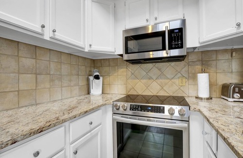 Airlie Condo | Experience Coastal Luxury at The Waterway 405: Marina Views, Pool, Dining!