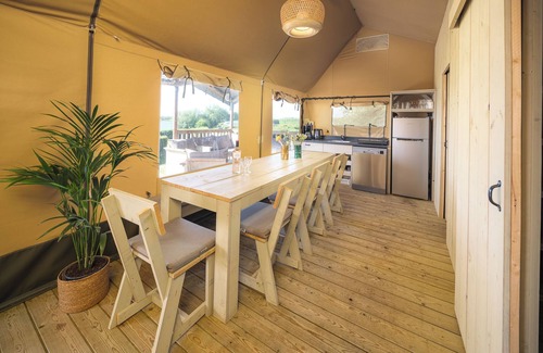 Lathum House | Experience luxury glamping in the elevated Safari Tent Ranger by the water.