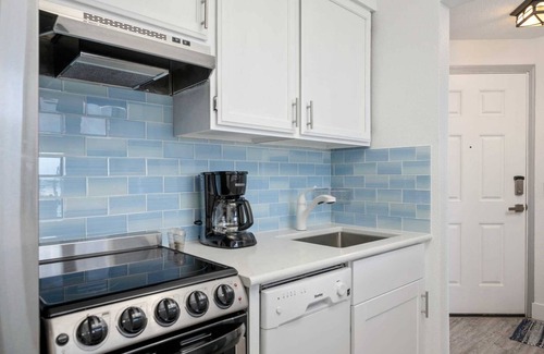 Rockaway Beach Condo | Exquisite Oceanfront and Beach Views at Rockaway Creek Inn, Patio and Living Bathed In Natural Light