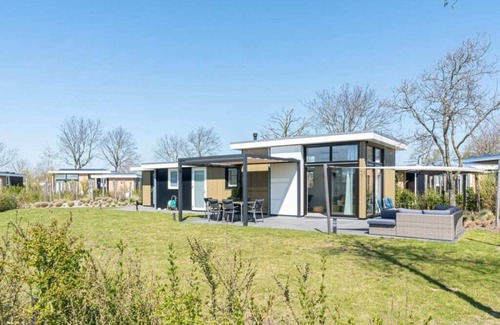 Burgh-Haamstede House | Extensive garden with spacious terraces and even space for a relaxing hammock. With the shade cloth