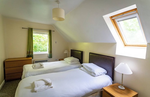 Farley Cabin | Farley; woodland lodge for 8 with hot tub, log burner, BBQ, near Alton Towers.