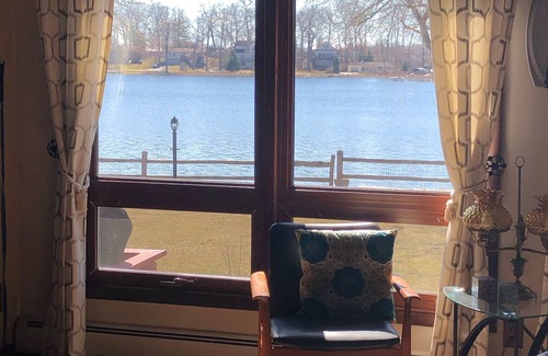 Howell House | Fenced in yard! Lovely Mid Century Feel with all Bedrooms facing the Water!