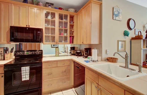Folly Beach Condo | First-floor villa w/partial ocean views, covered porch -one block from the beach