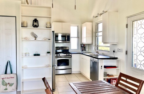 Long Bay Cottage | Flame Tree Cottage. Private home with pool and ocean view. 1/2 mile to beach