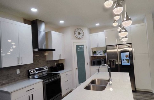 Transcona House | Flamingo Home! A family-friendly home with 4 bedrooms and 3 bathrooms.