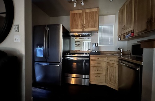 Elkhorn Village Condo | Floor level, Pet friendly, porch and barbecue