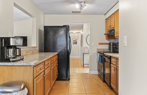 Palm Harbor House | FREE Heated Pool 3mi to beach W/D Game Room King bed Bikes Lake View