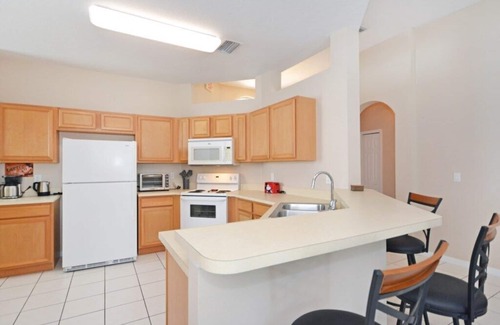 Haines City House | Freshly furnished home in gated community with private west facing pool!