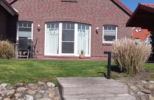 Greetsiel House | Friesenkate with garden & boat dock on the Greetsieler canals for 6 adults & baby