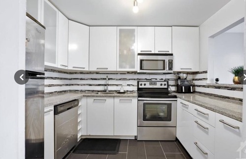 Ottawa Division Condo | Fully furnished bedroom in a cozy, modular home.