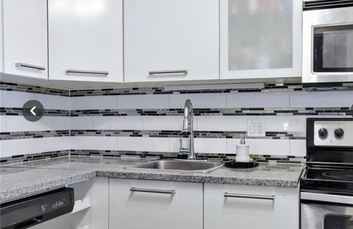 Ottawa Division Condo | Fully furnished bedroom in a cozy, modular home.