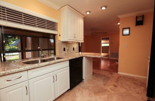 Tropic Palms House | Fun Magical Home On Canal-Relaxing Pool -Spa-Enjoy Fishing-Kayaks-WiFi-Near All