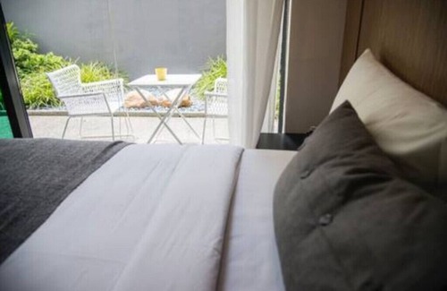 Bedok House | Garden master room with pool