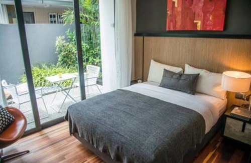 Bedok House | Garden master room with pool